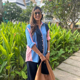 Blue and pink striped women’s shirt by Poppy & Co, featuring soft pastel stripes, lightweight fabric, and relaxed casual fit.
