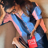 Blue and pink striped women’s shirt by Poppy & Co, featuring soft pastel stripes, lightweight fabric, and relaxed casual fit.
