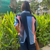 Blue and pink striped women’s shirt by Poppy & Co, featuring soft pastel stripes, lightweight fabric, and relaxed casual fit.
